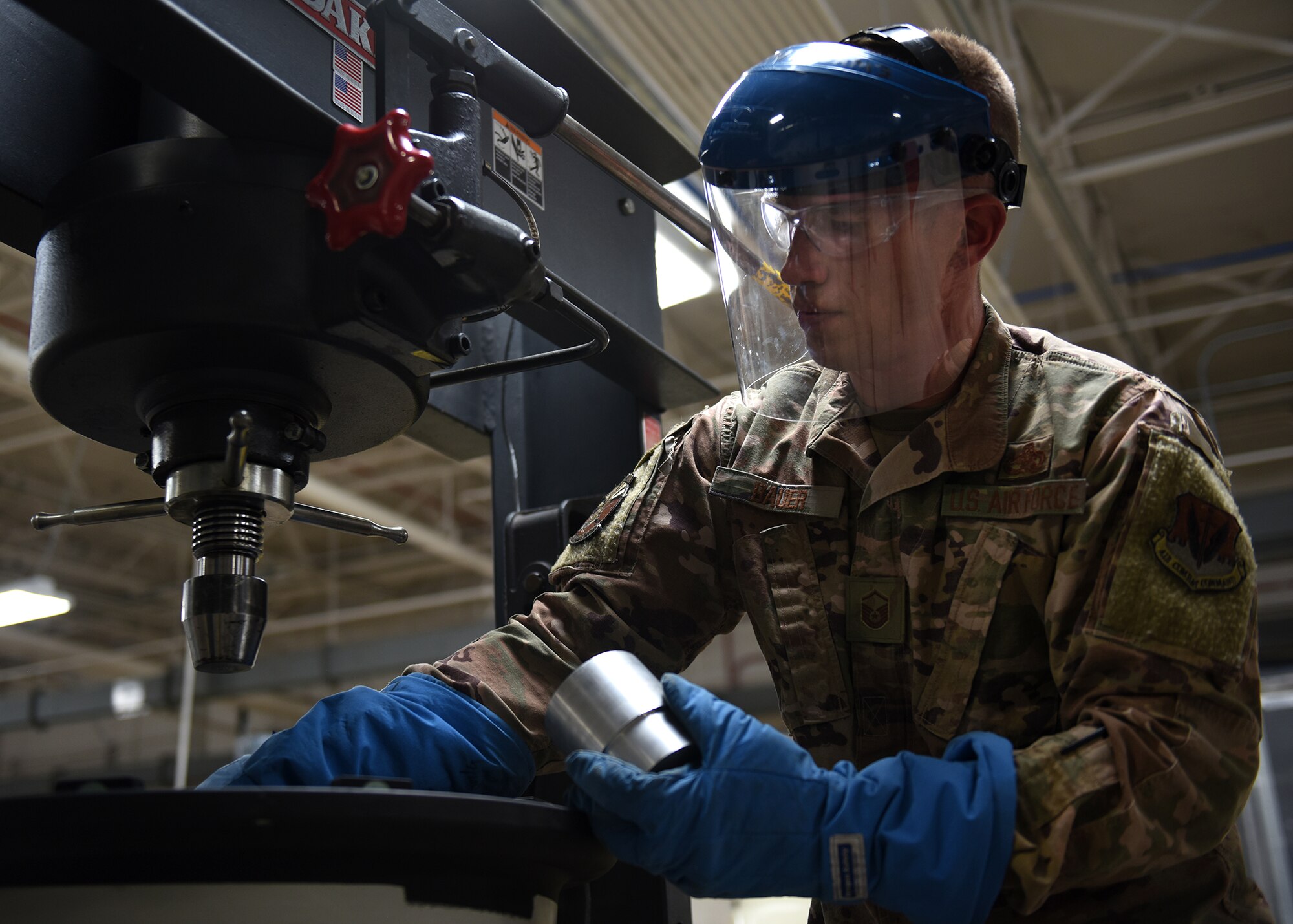 A photo of an Airman working working with tools.