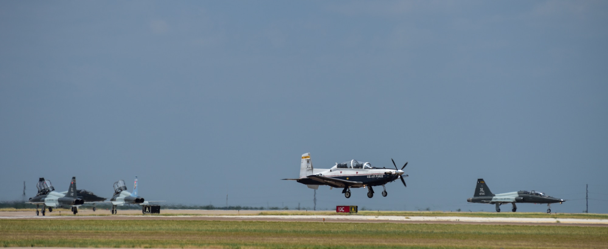 Four T-38C Talons prepare to depart from Laughlin Air Force Base, Texas, to fly in a dissimilar formation of aircraft, some over Del Rio and Eagle Pass and others over San Angelo Texas, May 21, 2020. The flyover consisted of the T-6A Texan II, T-1A Jayhawk and the T-38 and honored the men and women on the front lines of the fight against COVID-19 during the Defense Department’s #AmericaStrong salute. (U.S. Air Force photo by Senior Airman Anne McCready)