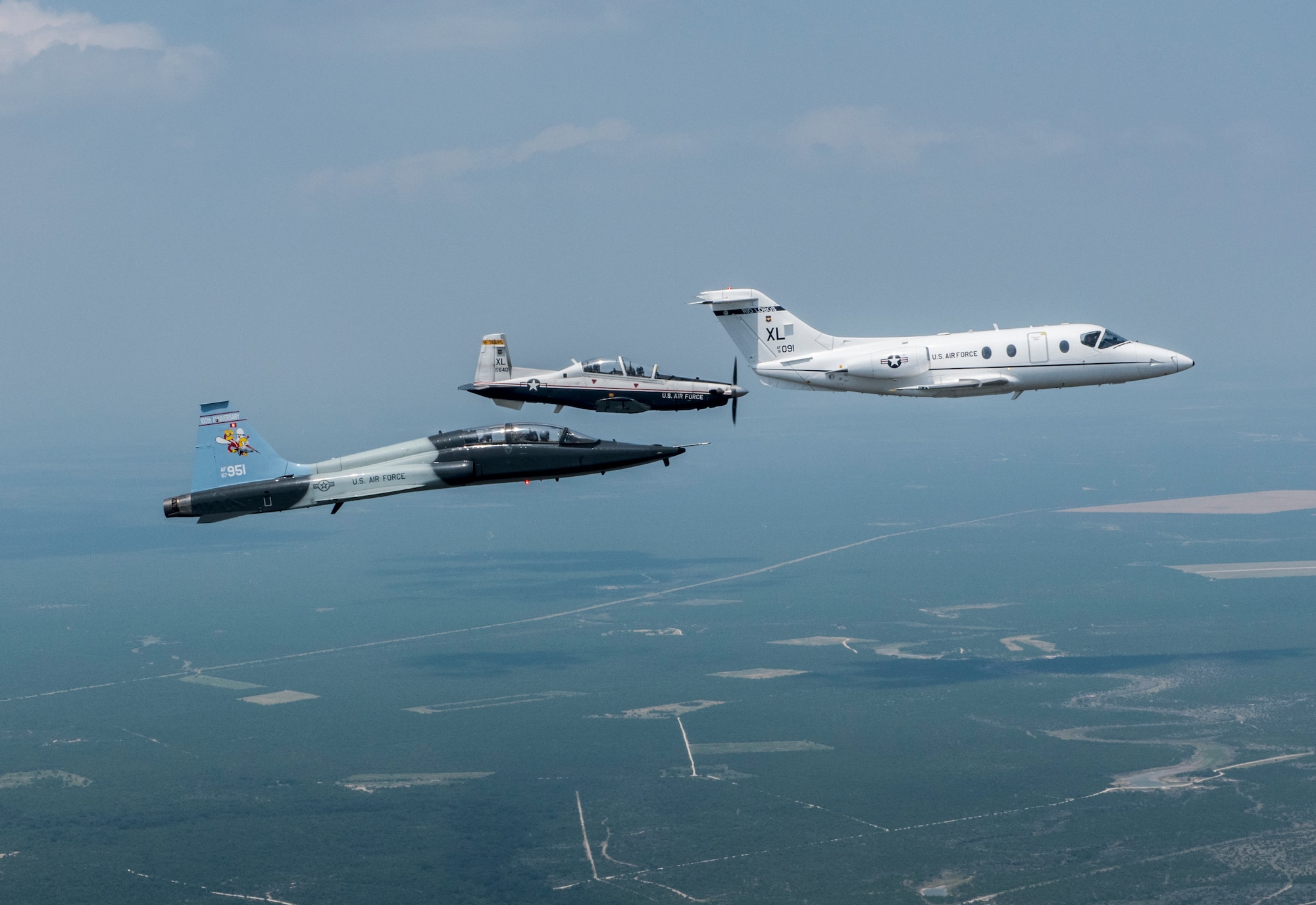 T-6 Texan II, T-1A Jayhawk and a T-38C Talon, assigned to Laughlin Air Force Base, Texas, perform a flyover in San Angelo, Texas, May 21, 2020. Laughlin performed flyovers in three Texas cities as a part of the America Strong America Salutes Campaign, to show its gratitude for all front-line responders, economy sustainers and community members in the COVID-19 pandemic. (U.S. Air Force photo by Master Sgt. JT May III)