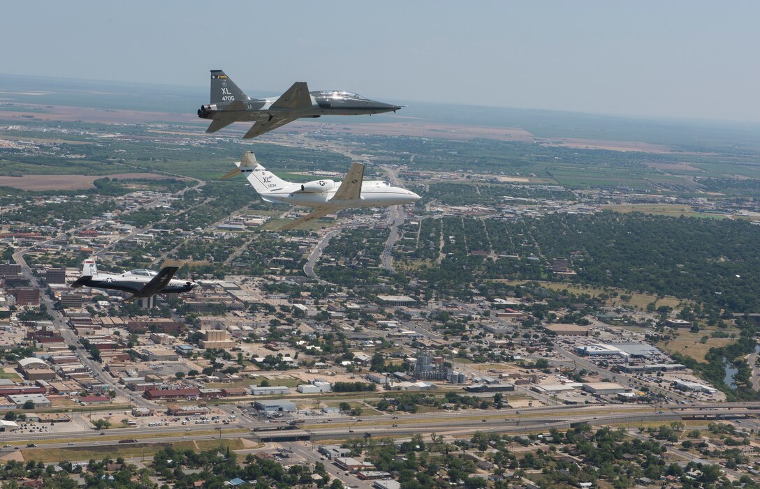 A T-6 Texan II, T-1A Jayhawk and a T-38C Talon, assigned to Laughlin Air Force Base, Texas, perform a flyover in San Angelo, Texas, May 21, 2020. Laughlin performed flyovers in three Texas cities as a part of the America Strong America Salutes Campaign, to show its gratitude for all front-line responders, economy sustainers and community members in the COVID-19 pandemic. (U.S. Air Force photo by Staff Sgt. Benjamin N. Valmoja)