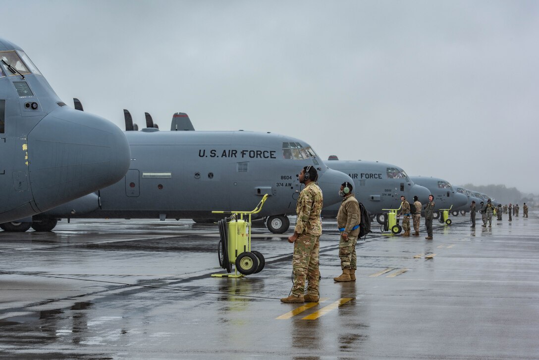 C-130J Super Hercules aircraft with the 36th Airlift Squadron sit on the flight line for pre-flight inspections prior to starting the elephant walk portion of the Samurai Surge training exercise, May 21, 2020, at Yokota Air Base, Japan.
