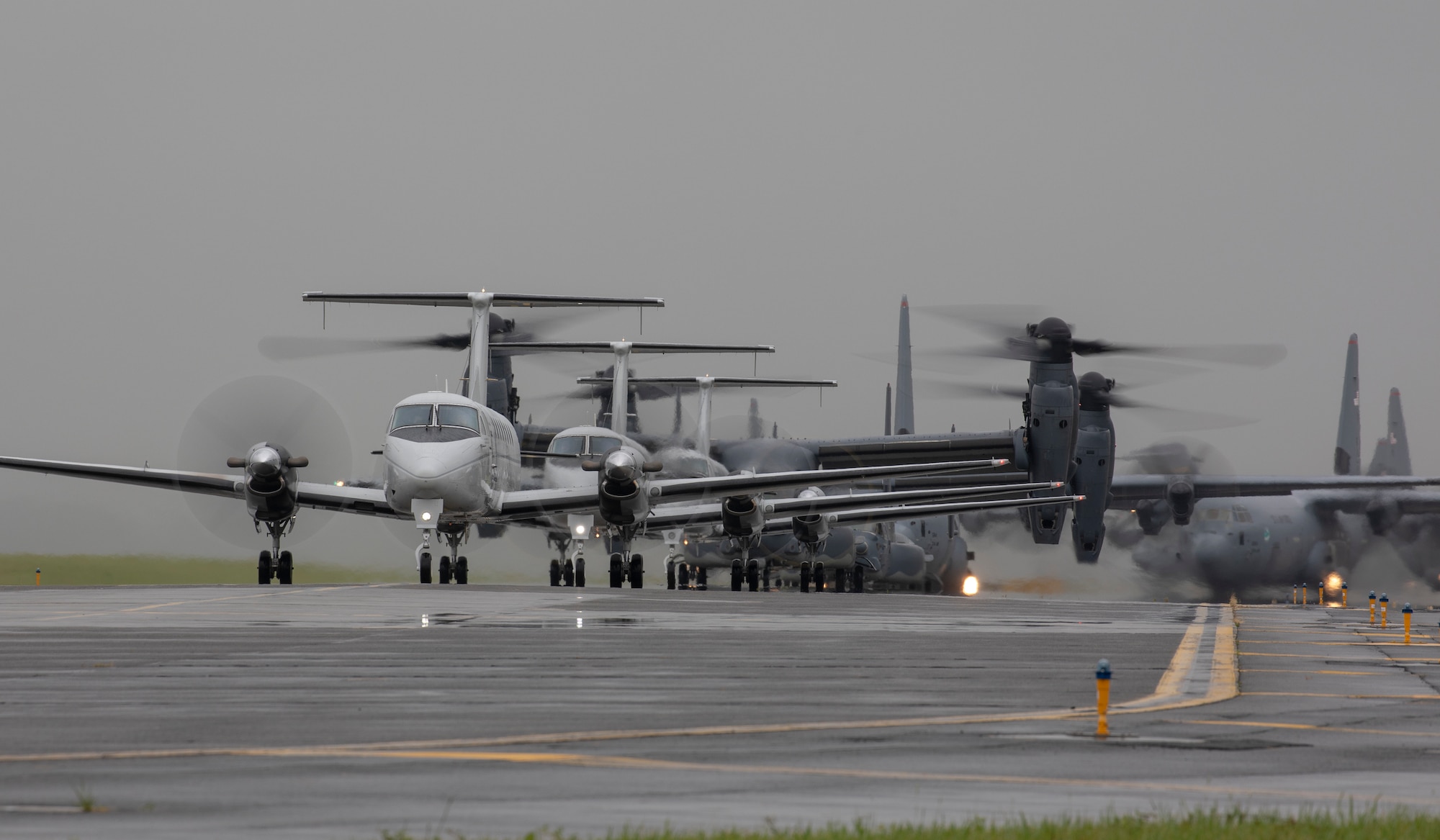 Aircraft from the 36th Airlift Squadron, 459th Airlift Squadron and 21st Special Operations Squadron taxi their way across the Yokota Air Base, Japan flightline during the elephant walk portion of the Samurai Surge training exercise, May 21, 2020.
