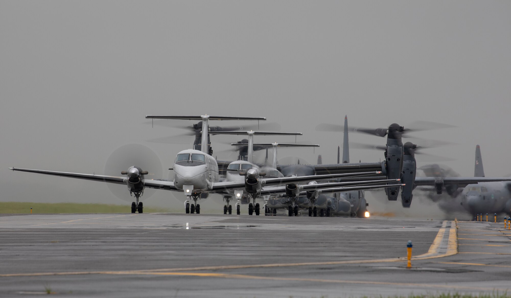 Aircraft from the 36th Airlift Squadron, 459th Airlift Squadron and 21st Special Operations Squadron taxi their way across the Yokota Air Base, Japan flightline during the elephant walk portion of the Samurai Surge training exercise, May 21, 2020.