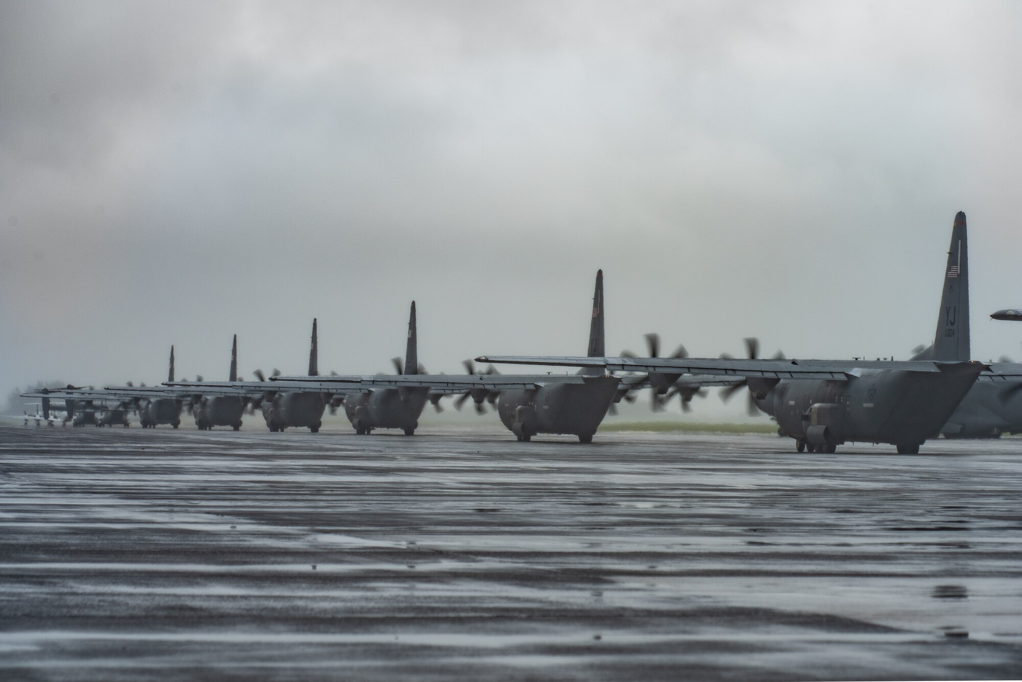Multiple C-130J Super Hercules aircraft with the 36th Airlift Squadron taxi on the flight line during the elephant walk portion of the Samurai Surge training exercise, May 21, 2020, at Yokota Air Base, Japan.