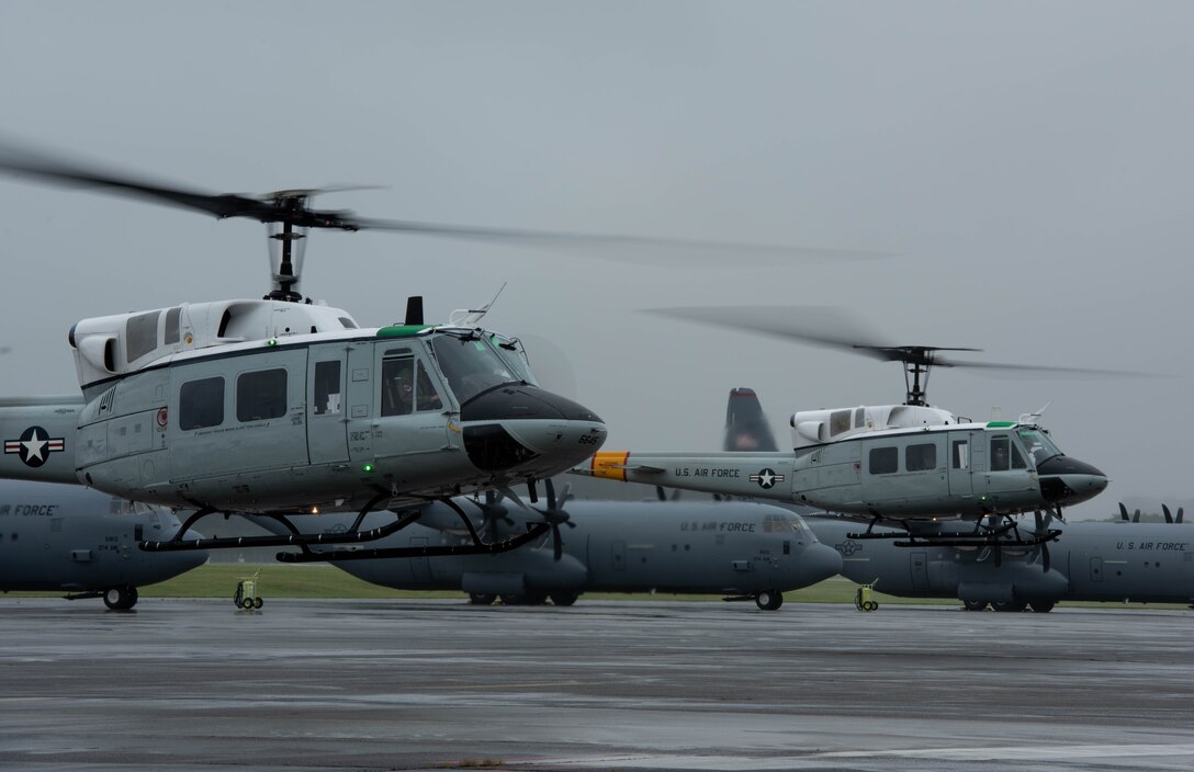 Two UH-1N Iroquois with the 459th Airlift Squadron take off during the 374th Airlift Wing’s Samurai Surge training exercise, May 21, 2020, at Yokota Air Base, Japan.