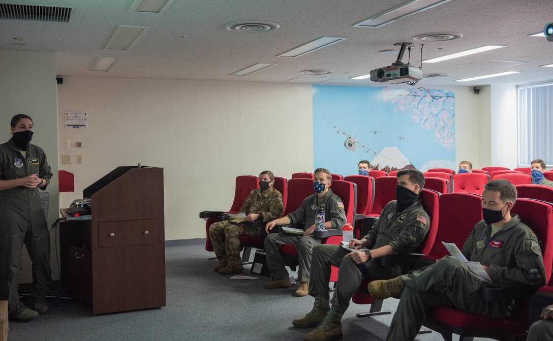 Aircrews conduct a physically distant pre-flight briefing before stepping out to their aircraft as part of the 374th Airlift Wing’s Samurai Surge training exercise.