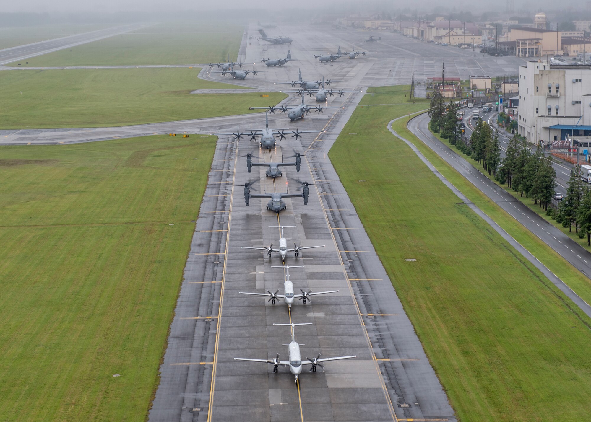 Aircraft from the 36th Airlift Squadron, 459th Airlift Squadron and 21st Special Operations Squadron taxi their way across the Yokota Air Base, Japan, flightline during the
elephant walk portion of the Samurai Surge training exercise, May 21, 2020.