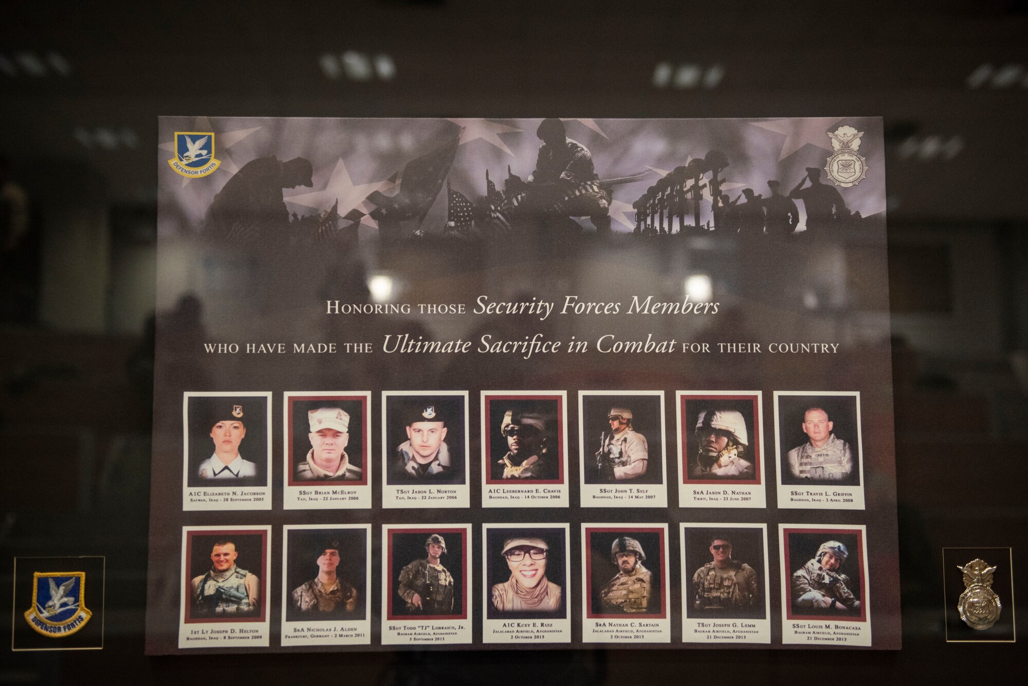 A memorial bears the names and images of fallen security forces Airmen during a Final Guard Mount ceremony May 15, 2020, at Incirlik Air Base, Turkey. The 39th Security Forces Squadron conducted the ceremony to conclude National Police Week. (U.S. Air Force photo by Staff Sgt. Joshua Magbanua)