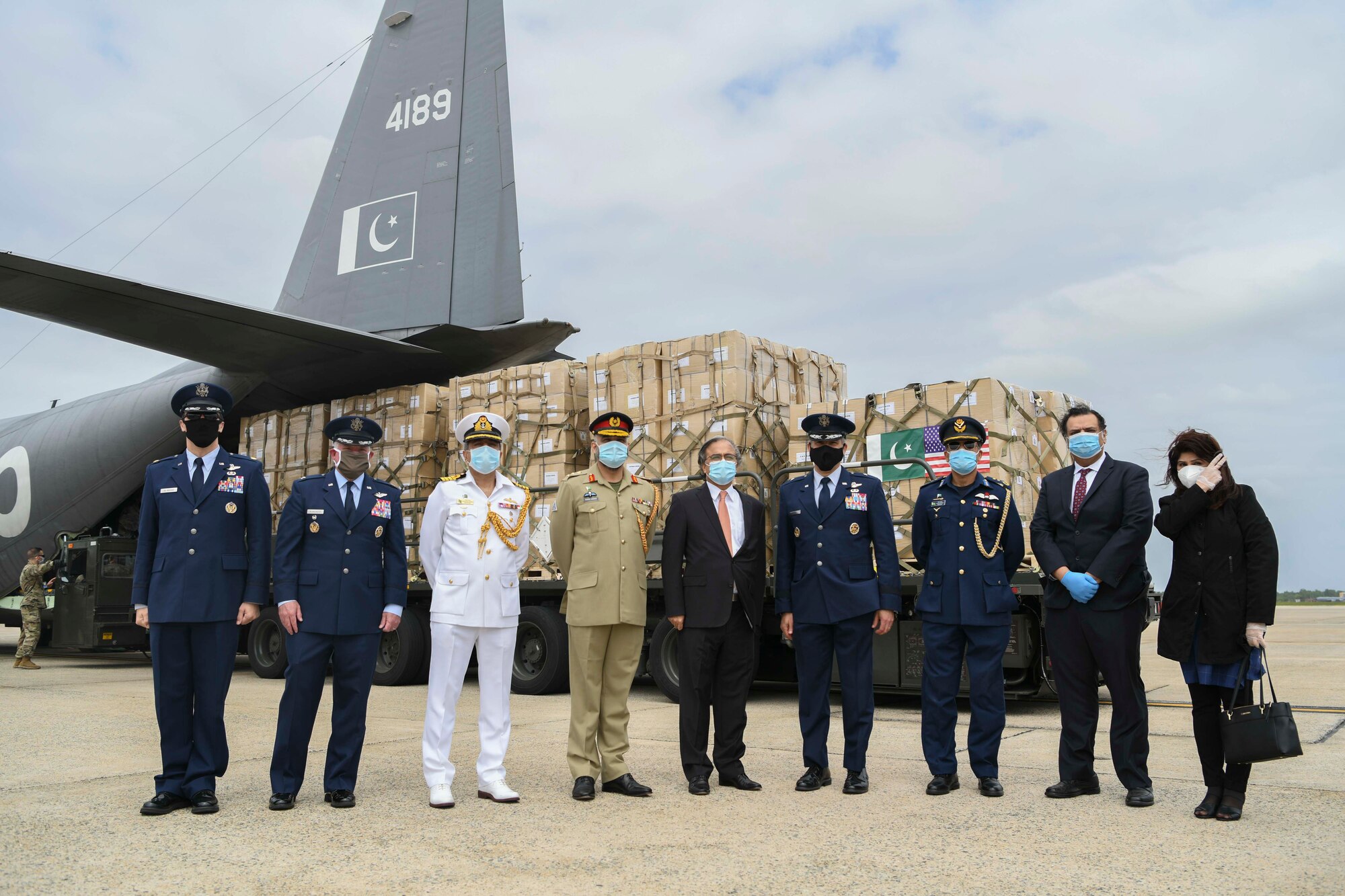 U.S and Pakistani leadership pose for a photo in front of a Pakistan air force C-130 at Joint Base Andrews, Md., May 21, 2020. Ambassador Asad Majeed Khan, an official from the Pakistani Embassy, noted the armed forces of both countries have fought together in the Global War on Terrorism and stand together in the fight against the COVID-19 pandemic. (U.S. Air Force photo by Airman 1st Class Spencer Slocum)