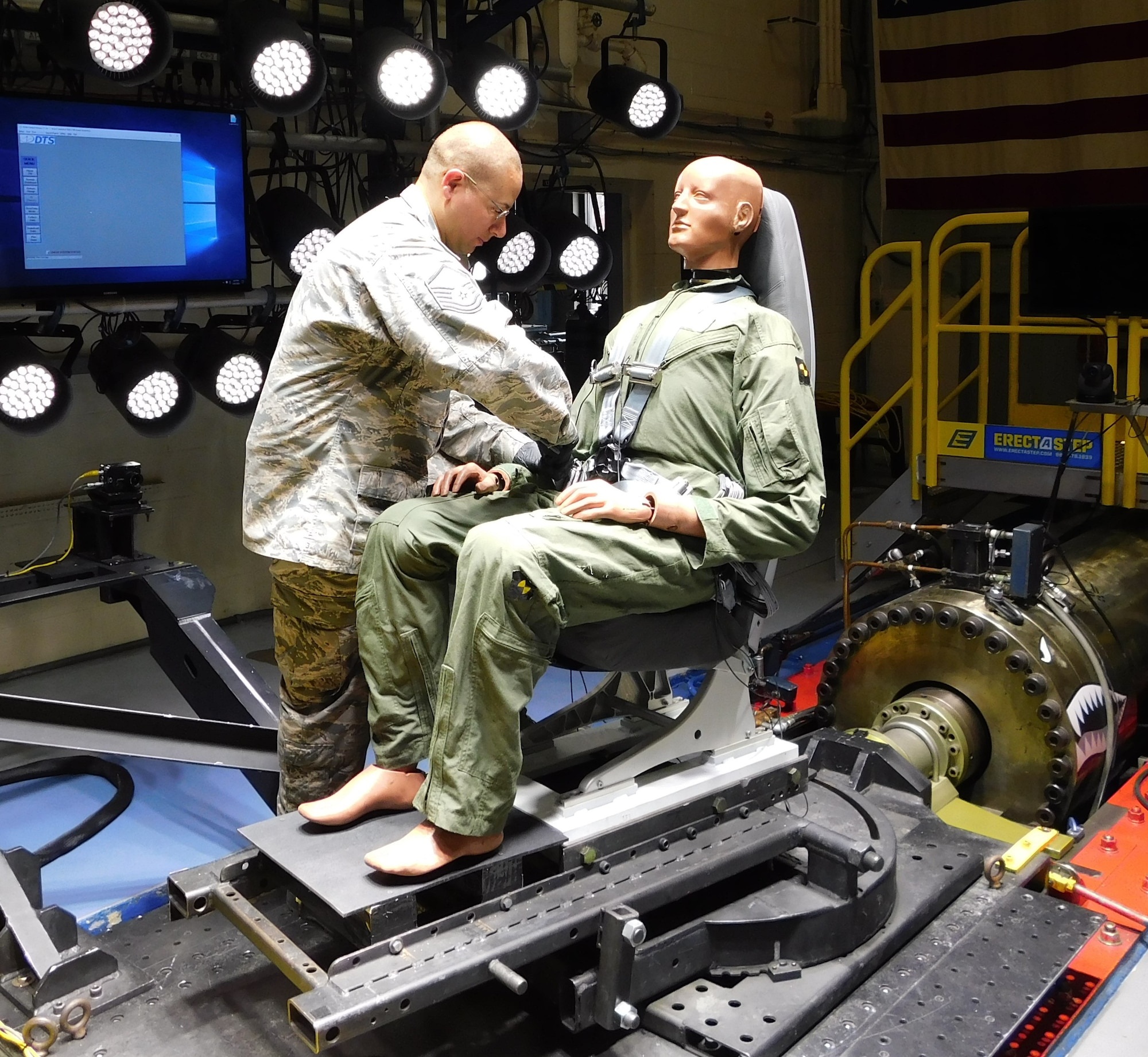 Master Sgt. James Chase of the AFRL 711th Human Performance Wing Biodynamics team prepares an instrumented 250-pound test device, simulating a human occupant, for seat testing on the Horizontal Impulse Accelerator, located at Wright-Patterson Air Force Base. The test is one of a series recently conducted to support the acceptance and implementation of the Portable Biocontainment Care Module, which will aid in the safe transport of personnel affected by infectious diseases, including COVID-19. (Photo courtesy of Infoscitex Corporation/Christopher Albery)