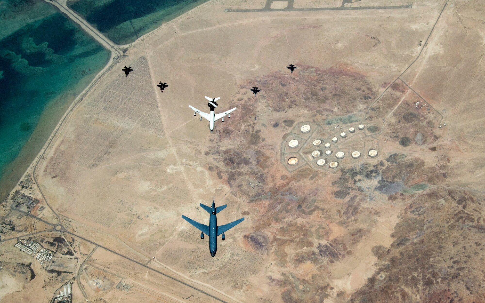 Aircraft with the 380th Air Expeditionary Wing fly in formation
