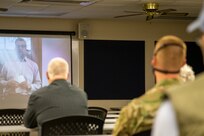 Seven Nebraska Army National Guard Soldiers with the 181st Engineer Detachment (Firefighter Team) and their families watch recorded video messages from government leaders including Norfolk Mayor Josh Moenning (on screen left), May 17, 2020, during a brief send-off ceremony before their yearlong overseas deployment to Romania.