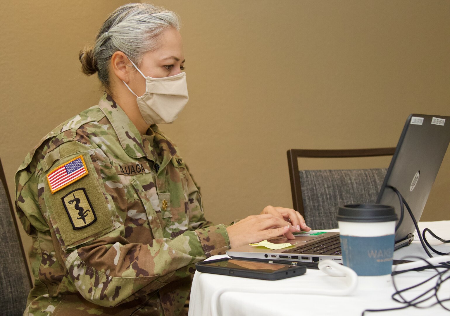 Florida National Guard Maj. Jacqueline S. Zuluaga, 256th Medical Company Area Support company commander, works on mission requirements for scheduling of long-term care facility COVID-19 testing. The FLNG is working closely with federal, state and local partners during the pandemic.
