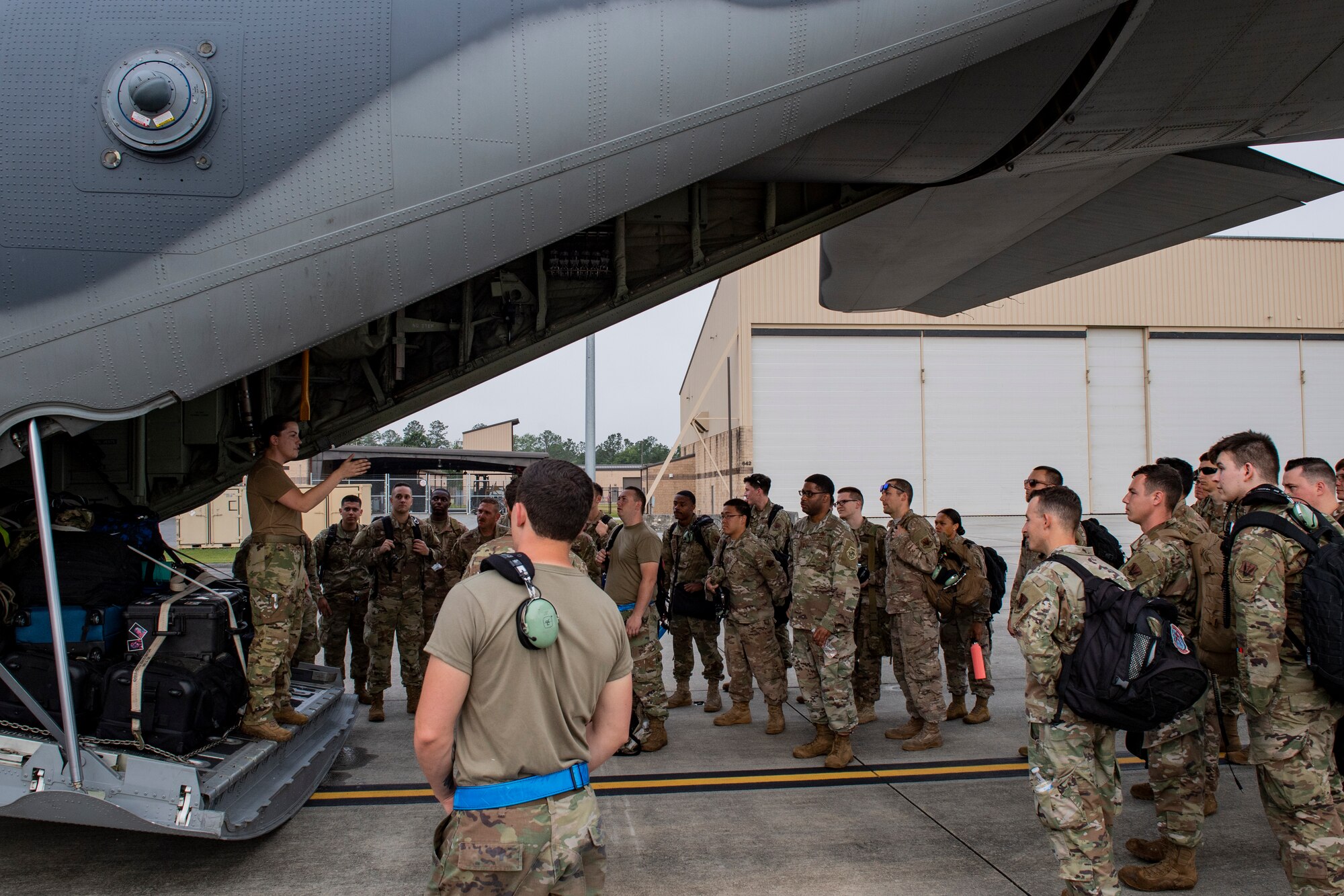 A photo of an Airman giving a briefing
