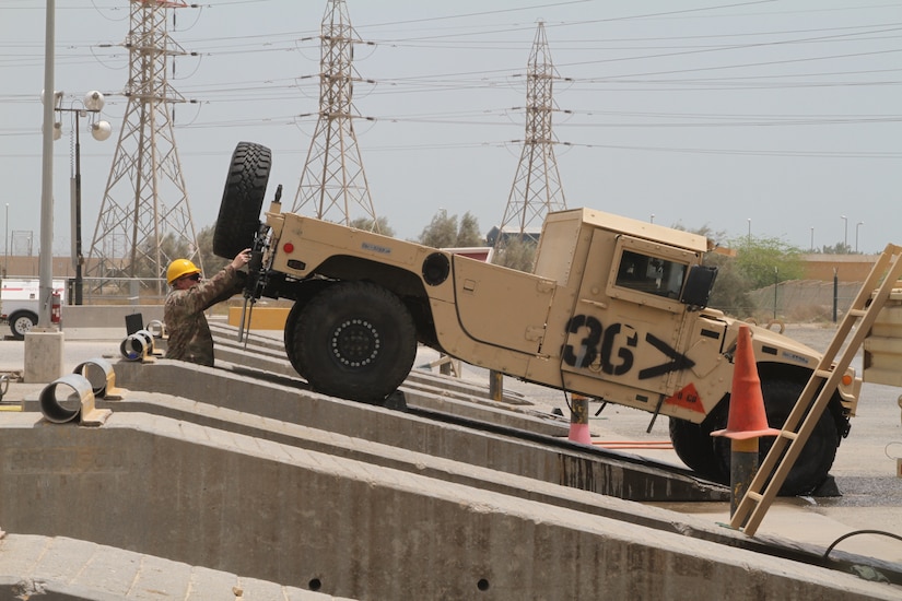 U.S. Army Soldiers assigned to the 30th Armored Brigade Combat Team, clean vehicles in Kuwait, May 13, 2020. The vehicles being prepared to be sent back to the U.S. After thorough cleaning and clearing by U.S. Customs officials. (U.S. Army photo by Sgt. Andrew Valenza)
