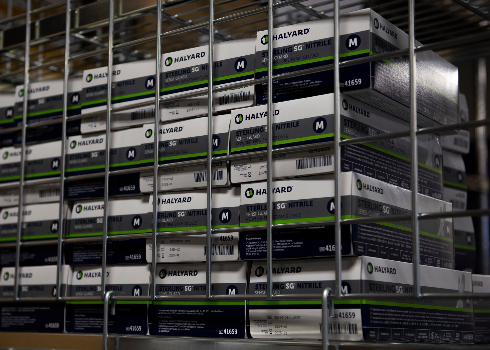 Plastic gloves sit on a shelf, May 19, 2020, at Mountain Home Air Force Base, Idaho. The medical logistics team were able to procure sneeze guards, and even went to a local company who built face shields for Airmen. (U.S. Air Force photo by Airman 1st Class Natalie Rubenak)