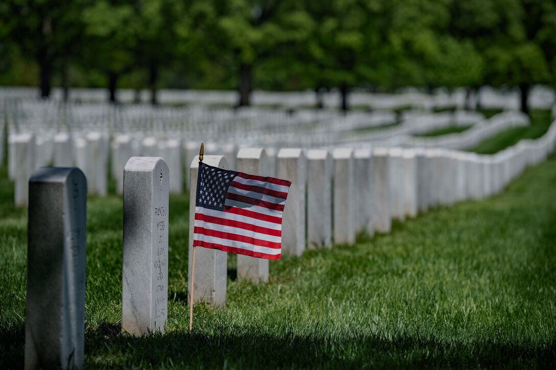 A U.S. flag is placed at a headstone in Section 60 of Arlington National Cemetery, Arlington, Virginia, May 4, 2020. (U.S. Army photo by Elizabeth Fraser / Arlington National Cemetery / released)