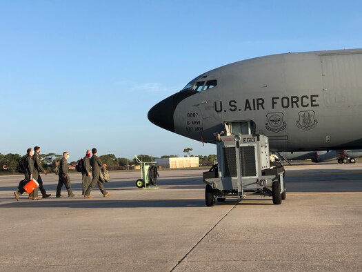 Aircrew with the 63rd Air Refueling Squadron walk toward a KC-135 Stratotanker aircraft, May 15, 2020 at MacDill Air Force Base, Fla.