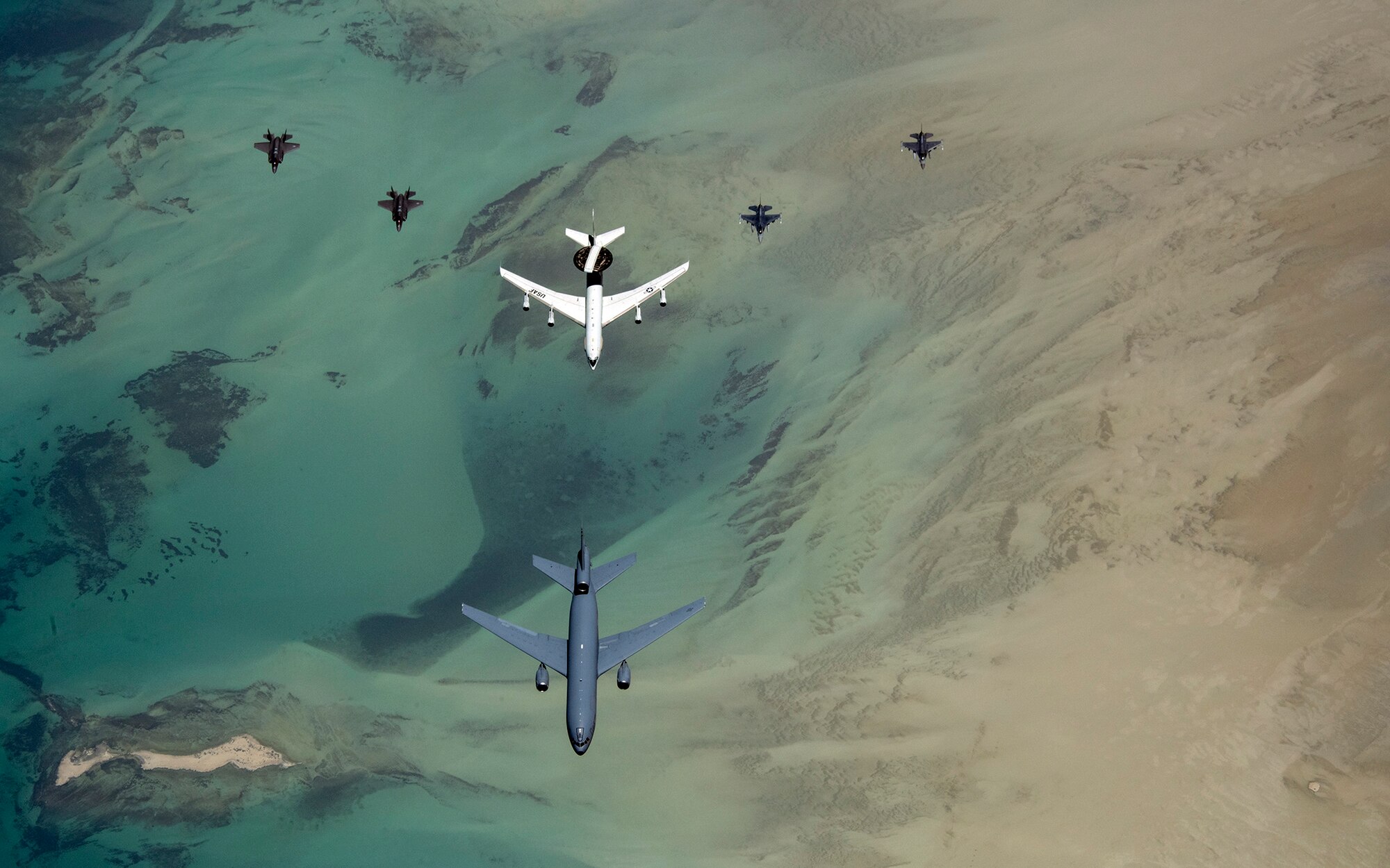 Aircraft with the 380th Air Expeditionary Wing fly in formation