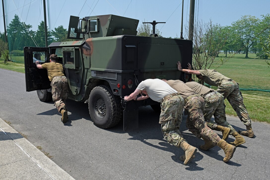 Wolf Pack Defenders compete in the Defender’s Challenge during National Police Week at Kunsan Air Base, Republic of Korea, May 21, 2020. National Police Week pays special recognition to law enforcement officers who have lost their lives in the line of duty for the safety and protection of others. (U.S. Air Force photo by Staff Sgt. Mackenzie Mendez)