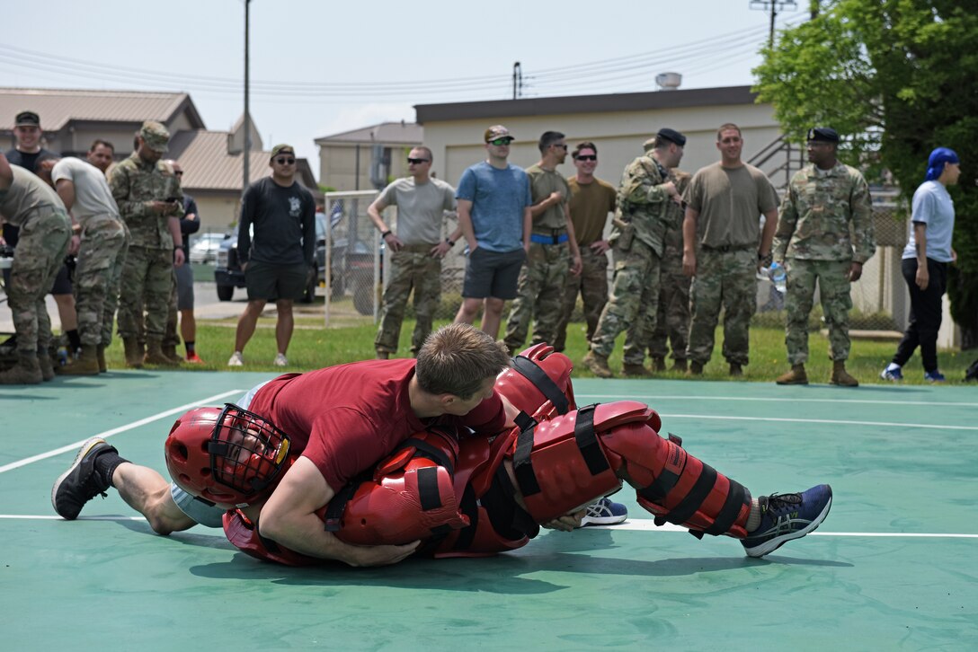 Wolf Pack Defenders compete in the Defender’s Challenge during National Police Week at Kunsan Air Base, Republic of Korea, May 21, 2020. National Police Week pays special recognition to law enforcement officers who have lost their lives in the line of duty for the safety and protection of others. (U.S. Air Force photo by Staff Sgt. Mackenzie Mendez)