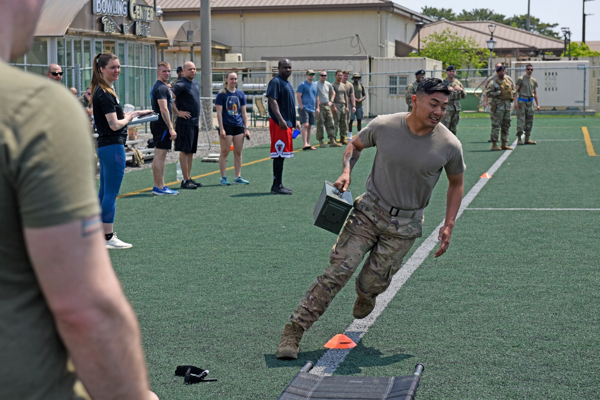 Wolf Pack Defenders compete in the Defender’s Challenge, a relay race that honors the Air Force’s fallen security forces heroes, during National Police Week at Kunsan Air Base, Republic of Korea, May 21, 2020. The 8th Security Forces Squadron hosted a myriad of activities to pay tribute to the fallen and raise awareness about the National Law Enforcement Officers Memorial Fund, including a golf tournament, law enforcement display, memorial run and relay challenge. (U.S. Air Force photo by Staff Sgt. Mackenzie Mendez)