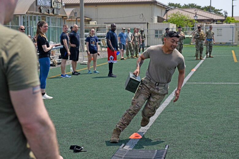 Wolf Pack Defenders compete in the Defender’s Challenge, a relay race that honors the Air Force’s fallen security forces heroes, during National Police Week at Kunsan Air Base, Republic of Korea, May 21, 2020. The 8th Security Forces Squadron hosted a myriad of activities to pay tribute to the fallen and raise awareness about the National Law Enforcement Officers Memorial Fund, including a golf tournament, law enforcement display, memorial run and relay challenge. (U.S. Air Force photo by Staff Sgt. Mackenzie Mendez)