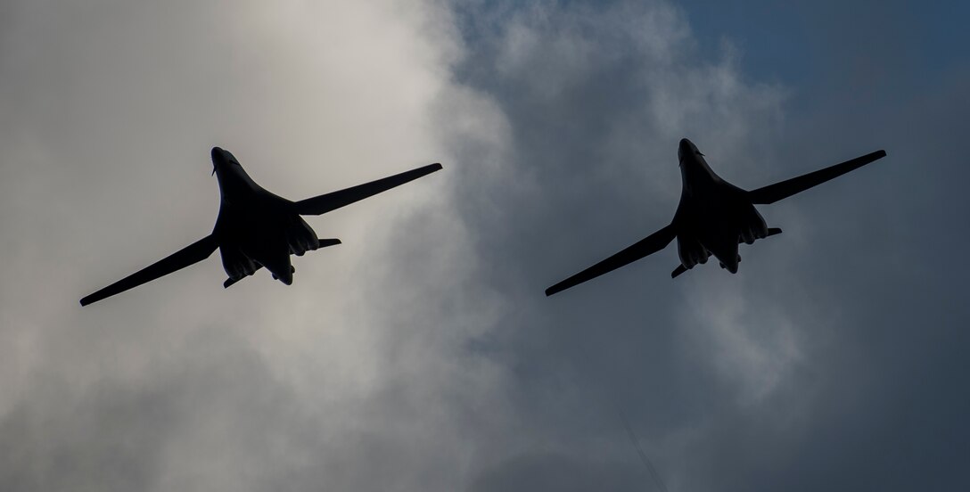 Two 9th Expeditionary Bomb Squadron B-1B Lancers fly in formation before landing at Andersen Air Force Base, Guam, May 22, 2020. These B-1B aircrews just completed a 24-hour mission that included a large force exercise. The 9th EBS is deployed to Andersen Air Force Base, Guam, as part of a Bomber Task Force supporting Pacific Air Forces’ strategic deterrence missions and  commitment to the security and stability of the Indo-Pacific region. (U.S. Air Force photo by Senior Airman River Bruce)