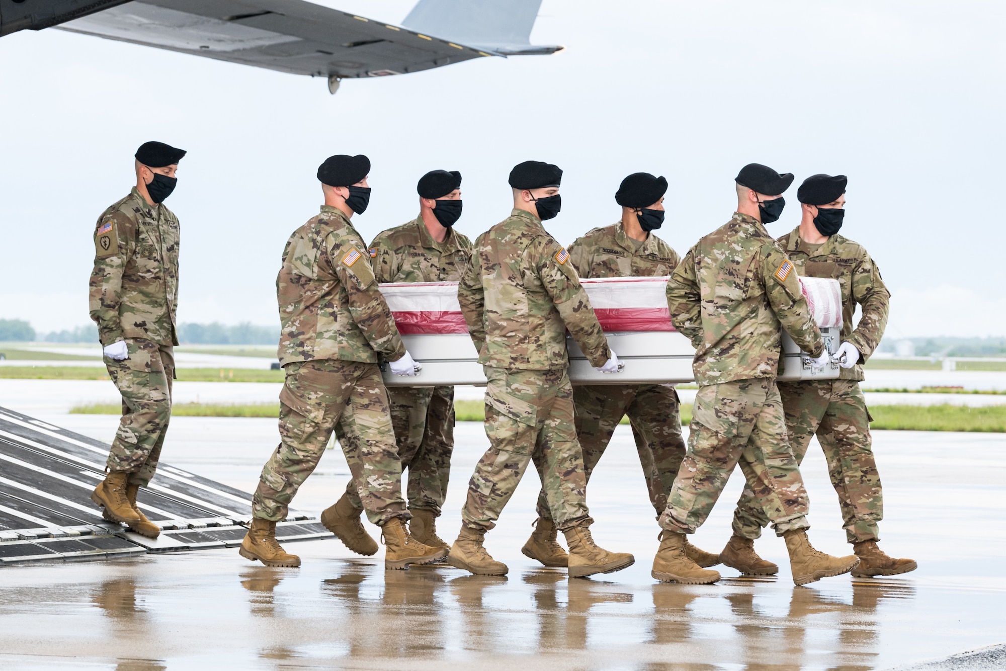 A U.S. Army carry team transfers the remains of 1st Lt. Trevarius R. Bowman, of Spartanburg, South Carolina, during a dignified transfer May 23, 2020, at Dover Air Force Base, Delaware. Bowman was assigned to Company B, 198th Signal Battalion, 261st Signal Brigade, Newberry, South Carolina. The unit is attached to the 228th Theater Tactical Signal Brigade, South Carolina National Guard. (U.S. Air Force photo by Roland Balik)