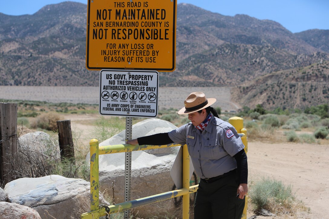 U.S. Army Corps of Engineers Los Angeles District Park Ranger Mary Carmona secures the gate at the Deep Creek road entrance May 17. Vandals have continually cut the locks and removed the chains that secure that gate at several of the Corps Mojave River Dam basins entrances in the County of San Bernardino. The area also known as the “Deep Creek Spillway” is located on federal property and is restricted to authorized motor vehicles and personnel.