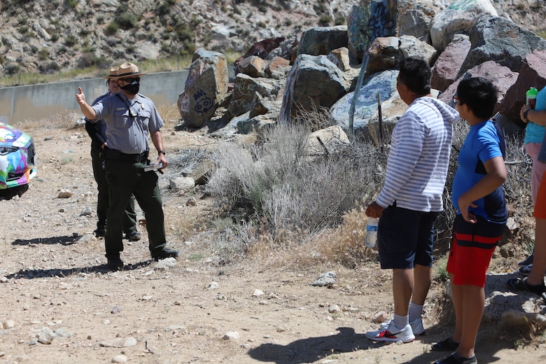 U.S. Army Corps of Engineers Los Angeles District Park Rangers Nick Figueroa and Mary Carmona issue parking citations May 17 to the owners of several vehicles that were illegally parked adjacent to the Corps’ Mojave River Dam emergency spillway in San Bernardino County. The area, also known as the “Deep Creek Spillway,” is located on federal property and is restricted to unauthorized motor vehicles.