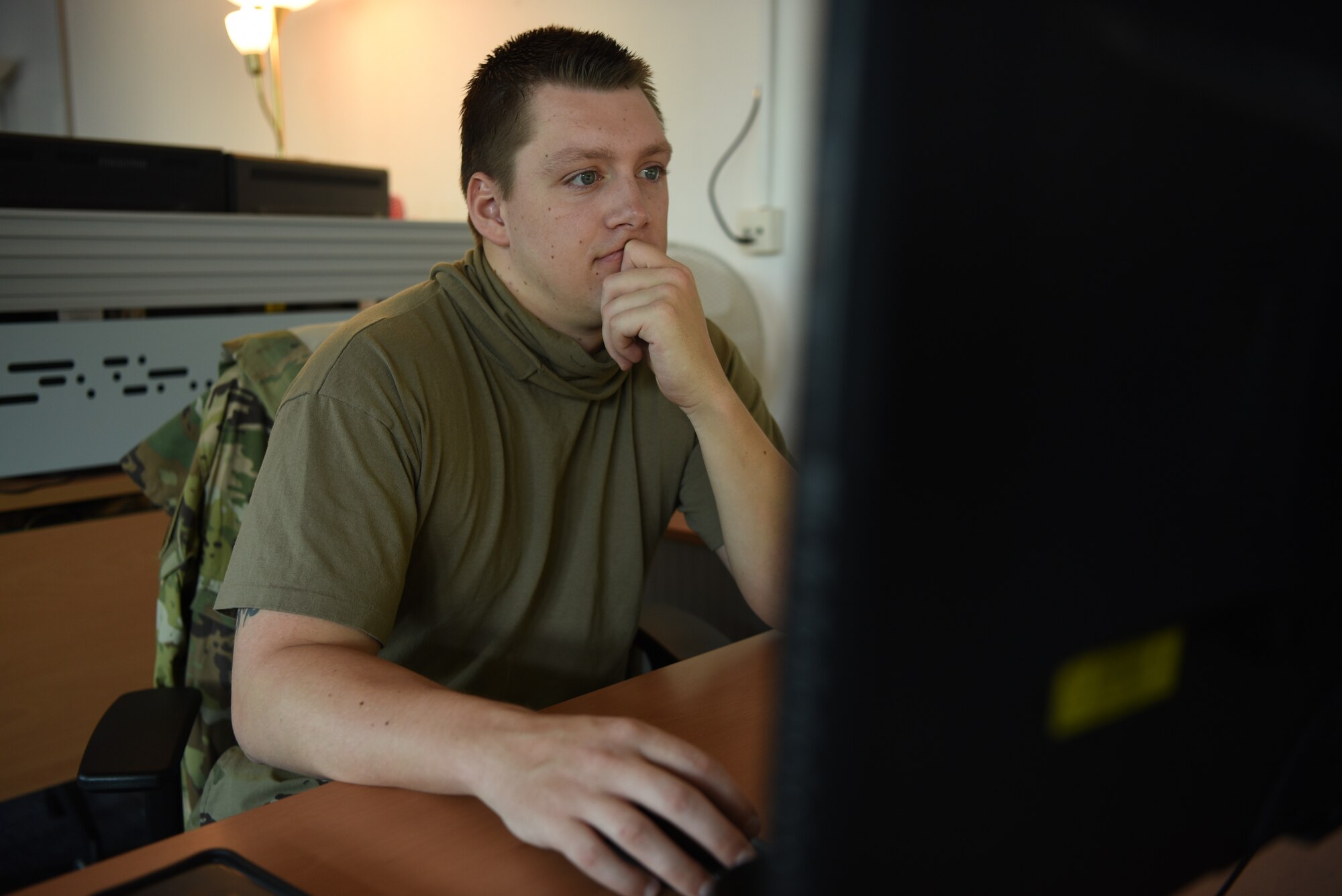 U.S. Air Force Staff Sgt. Taylor J. Eide, 721st Aircraft Maintenance Squadron quality assurance inspector, reviews the evenings evaluation and inspection plan to determine which inspections to perform at Ramstein Air Base, Germany, May 21, 2020.