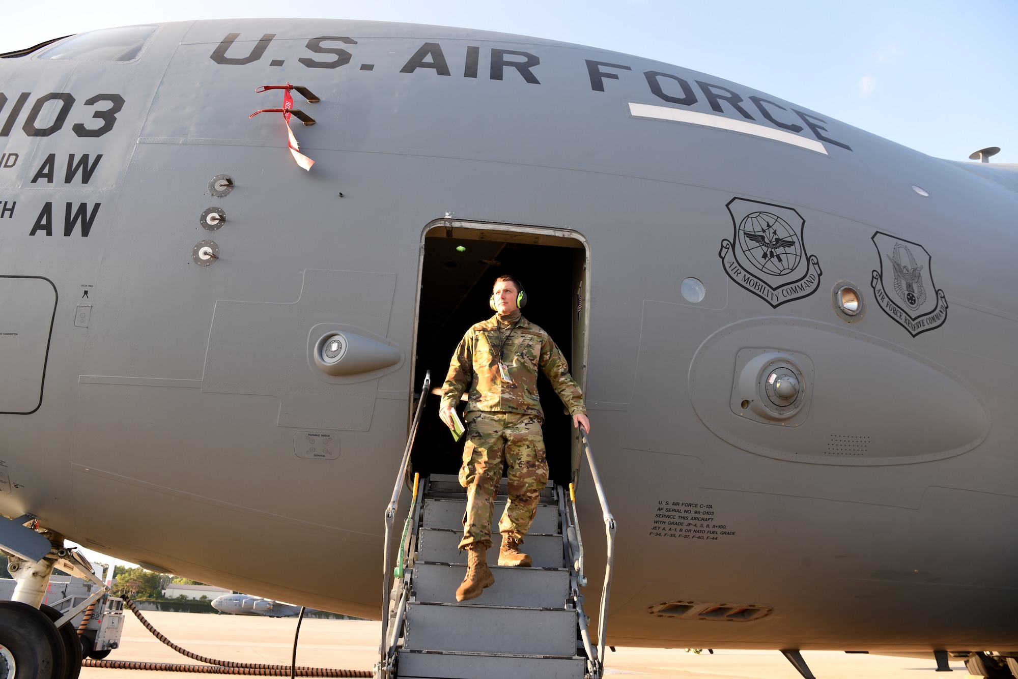 U.S. Air Force Staff Sgt. Taylor J. Eide, 721st Aircraft Maintenance Squadron quality assurance inspector, exits a C-17 Globemaster III aircraft at Ramstein Air Base, Germany, May 21, 2020.