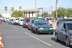Nevadans line up in their vehicles to receive food donations  at the Palace Station Casino, Thursday, May 21, 2020, in Las Vegas, Nevada. Eighteen members of the Nevada National Guard helped distribute food.