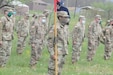 U.S. Soldiers with Headquarters and Headquarters Company, 28th Expeditionary Combat Aviation Brigade stand in formation while adhering to social distancing guidelines and COVID-19 mitigation directives.