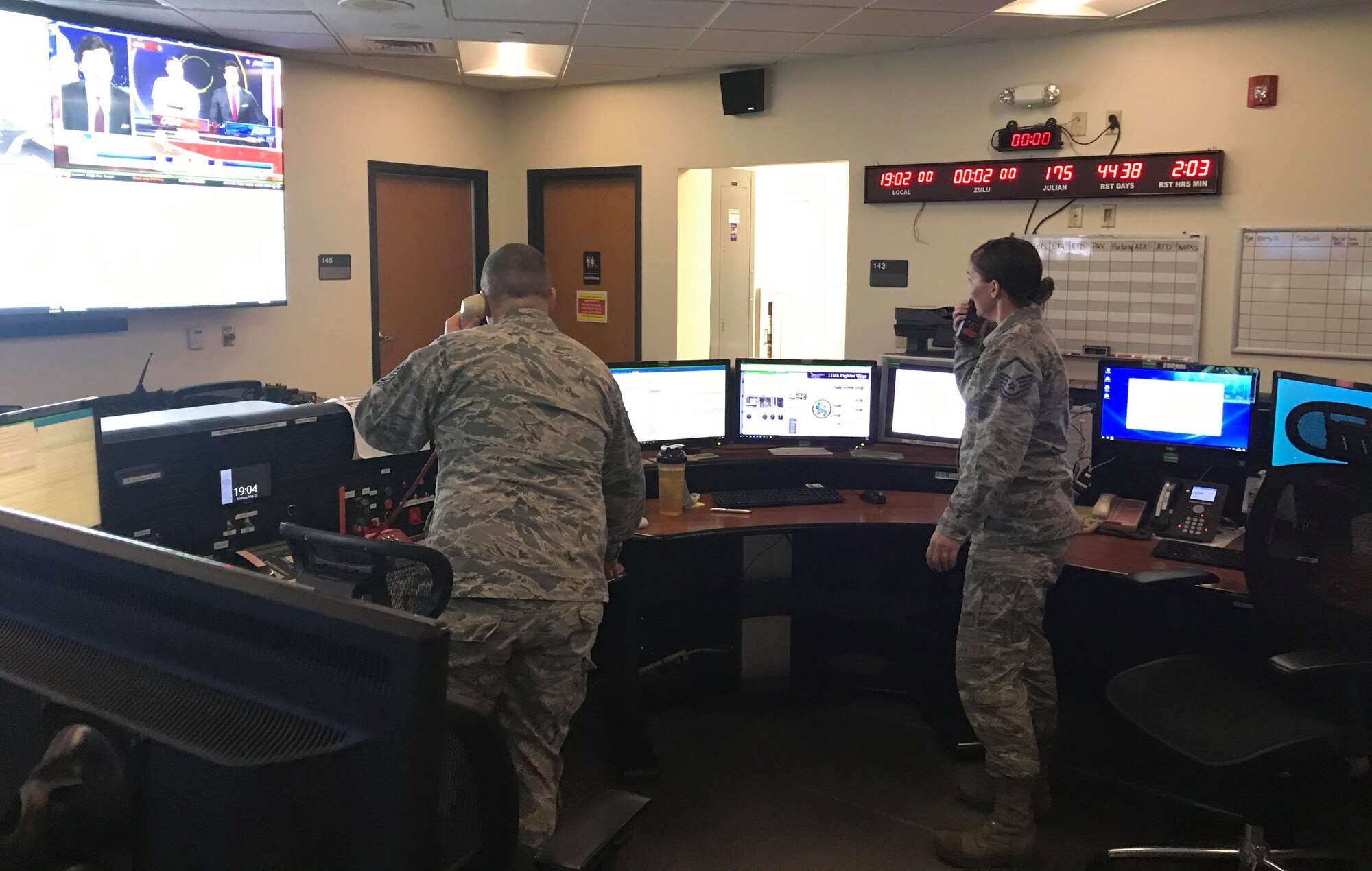 Command and control operations specialists work in the command post on base during the COVID-19 pandemic.