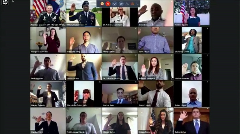 25 different people raise their right hand from their respective homes.