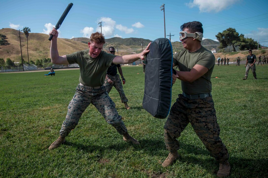 Marines were sprayed with oleoresin capsaicin in preparation for possible riot control situations while being forward deployed. (U.S. Marine Corps photo by Cpl. Sarah Stegall)