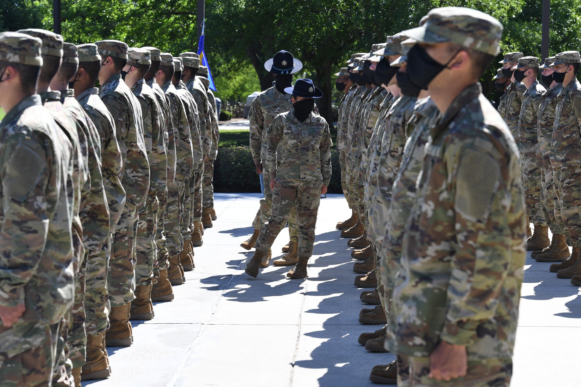 Military training instructor inspects ranks of Airmen
