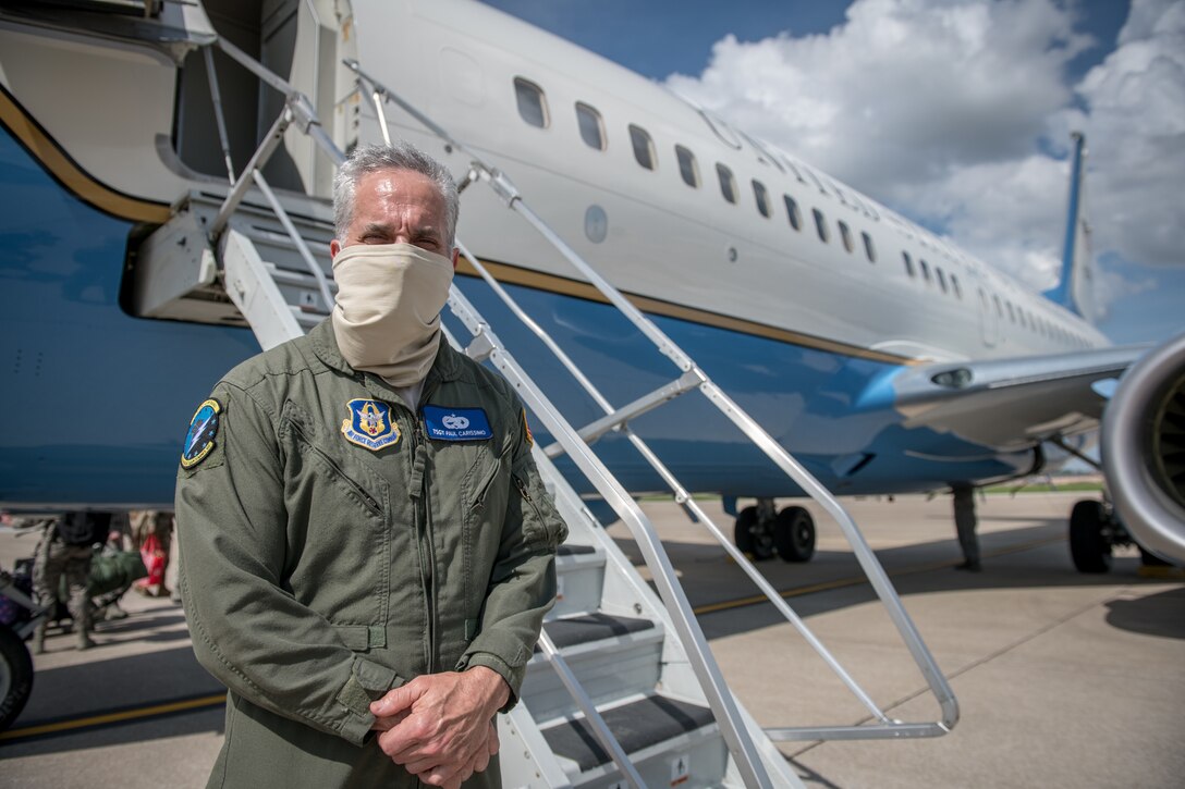 Tech. Sgt. Paul Carissimo, 932nd Maintenance Squadron crew chief, poses is front of a C-40C May 25, 2020, Scott Air Force Base, Illinois.  Crew chiefs have been working various shifts during COVID-19 to maintain the four C-40C aircrafts flown by the  932nd AW in support of essential training and operations. (U.S. Air Force photo by Christopher Parr)