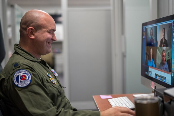 Lt. Col. Ryan Rickert,  53rd Weather Reconnaissance Squadron aerial reconnaissance weather officer, talks live via Skype with the host and participants of the National Tropical Weather Conference May 21, 2020, at Keesler Air Force Base, Mississippi. Rickert was accompanied by Capt. Garret Black, 53rd WRS ARWO, online to explain the Hurricane Hunter mission, their experiences flying storms, and the importance of being prepared for hurricane season. (U.S. Air Force photo by Tech. Sgt. Christopher Carranza)