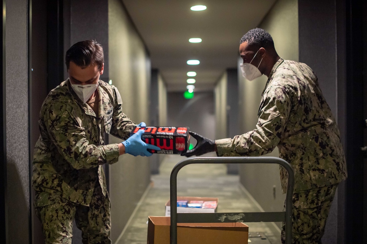 Sailors delivering food.