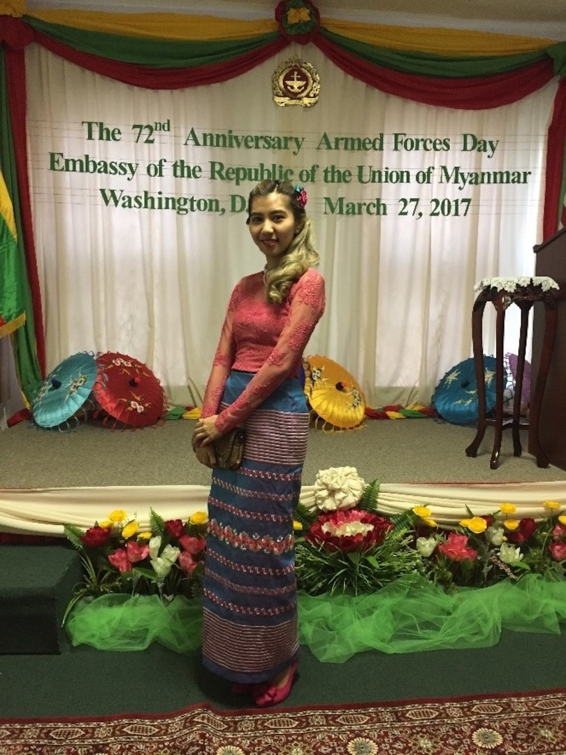 lady posing in front of banner in embassy of myanmar