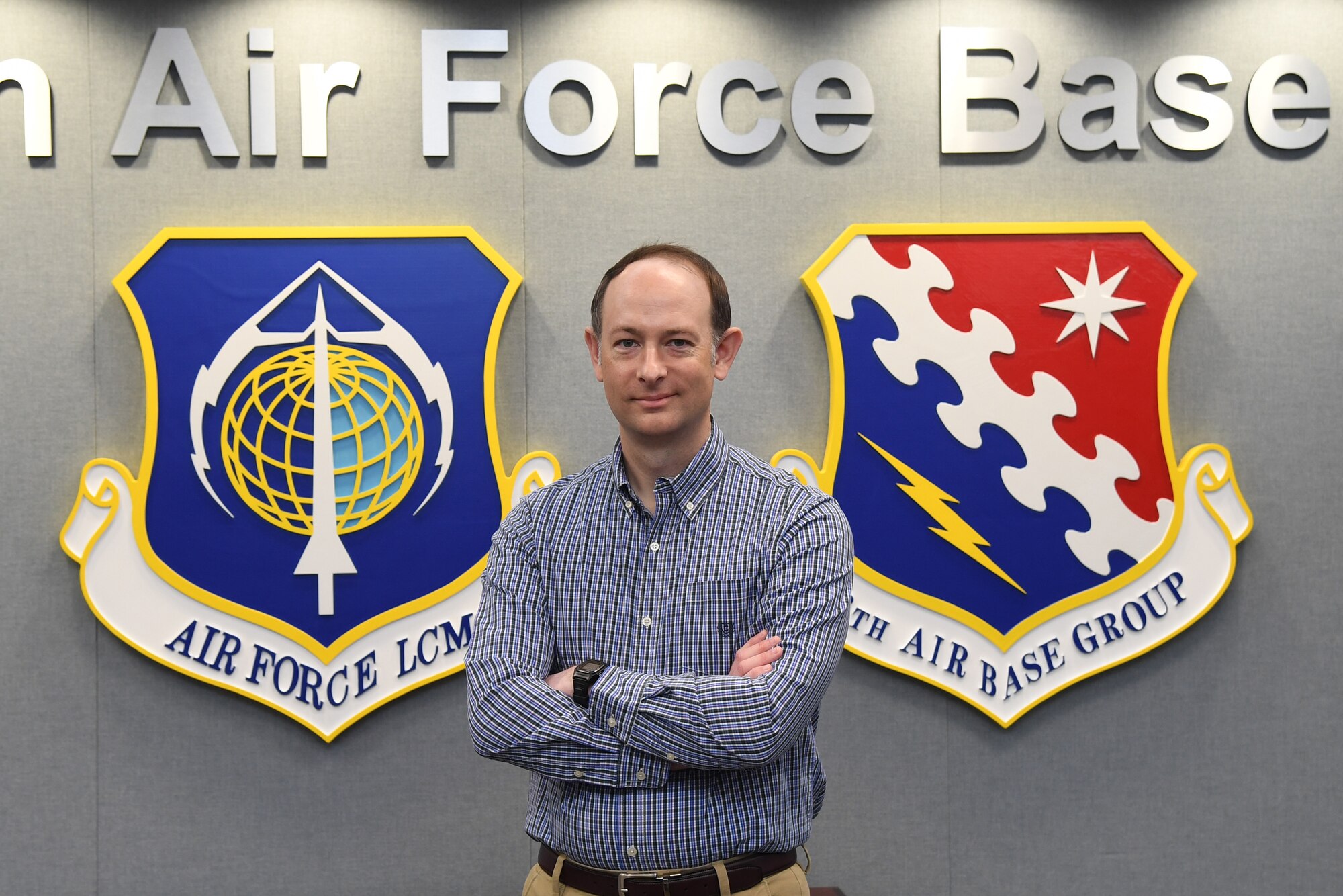 David Kedzierski, installation privatized housing resident advocate, poses for a photo on Hanscom Air Force Base, Mass., May 14. Kedzierski serves as a liaison between the privatized housing partner and residents to ensure quality housing and fair treatment for active duty members. (U.S. Air Force photo by Linda LaBonte Britt)