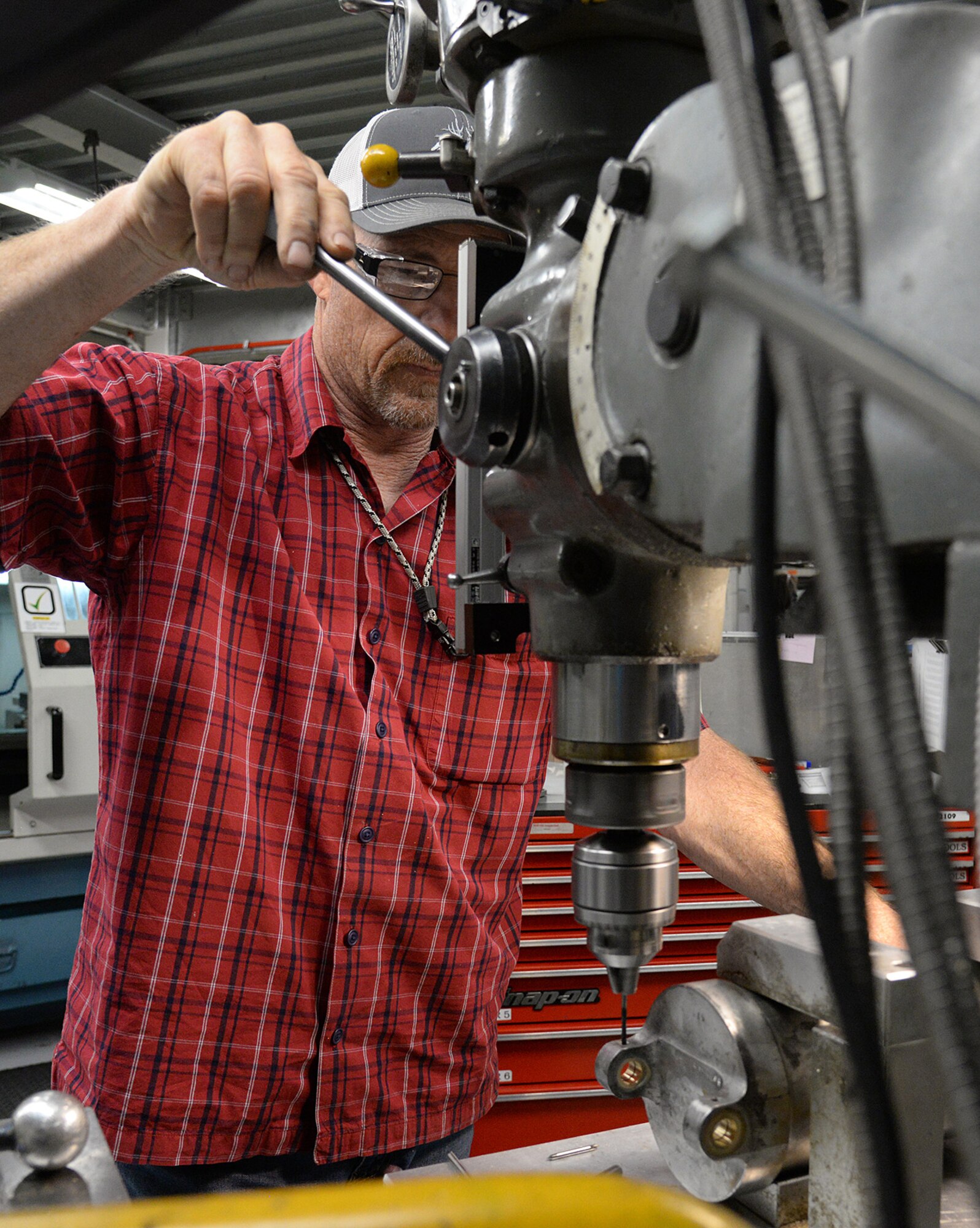 Bob Sanders, 533rd Commodities Maintenance Squadron, drills a bushing for a B-52 aircraft part May 5, 2020, at Hill Air Force Base, Utah. The skilled engineers and technicians of the 533rd CMMXS in the Ogden Air Logistics Complex, design, prototype and manufacture thousands of critical components annually, that can’t be found anywhere else in the world. The parts are manufactured in order to bridge a gap in the regular supply system, when there’s no contract in place from an outside source.