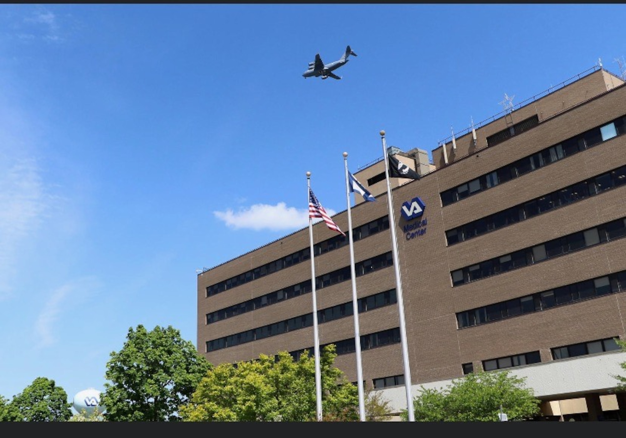 A C-17 Globemaster III from the 167th Airlift Wing, West Virginia Air
National Guard, flies over Winchester Medical Center, Winchester
Virginia, May 13, 2020, as part of America's tribute to front line
workers during COVID-19. The photo was shared by Tiffany English, a
physician's assistant at the medical center and sister of C-17 pilot
Brig. Gen. Melissa Coburn, 452nd Air Mobility Wing commander, March
Air Reserve Base, California. (Courtesy photo)