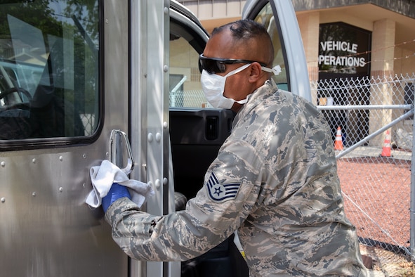 Staff Sgt. Aaron Antu, 433rd Logistics Readiness Squadron ground transportation operator, sanitizes a transportation vehicle being used to transport basic military training trainees who are being monitored for COVID-19 to and from medical facilities, May 21, 2020 at Joint Base San Antonio-Lackland, Texas.