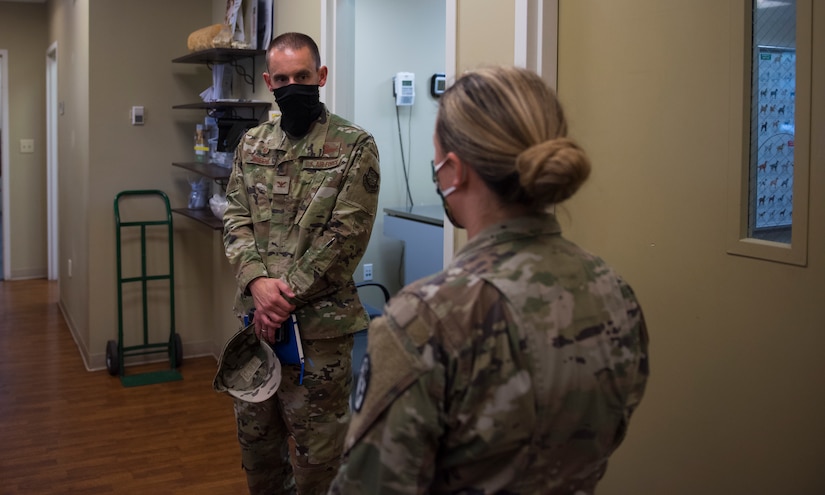 Col. Marc Greene, 628th Air Base Wing and joint base commander, listens to a brief at the veterinary clinic on Joint Base Charleston, S.C., May 21, 2020. Greene assumed command earlier this month, and he  toured the 628th ABW and multiple facilities to learn more about the Joint Base Charleston mission.