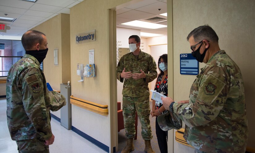 Col. Marc Greene, 628th Air Base Wing and joint base commander, listens to a brief at the optometry clinic on Joint Base Charleston, S.C., May 21, 2020. Greene assumed command earlier this month, and he  toured the 628th ABW and multiple facilities to learn more about the Joint Base Charleston mission.
