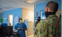 Col. Marc Greene, 628th Air Base Wing and joint base commander, listens to a brief at the 628th Medical Group on Joint Base Charleston, S.C., May 21, 2020. Greene assumed command earlier this month, and he  toured the 628th ABW and multiple facilities to learn more about the Joint Base Charleston mission.